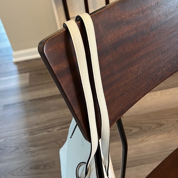 White,tote. Straps,bottom great condition. Front small wrinkle. - Picture 8 of 10